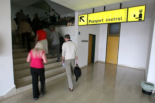 Passport control People going up a staircase to passport control.
